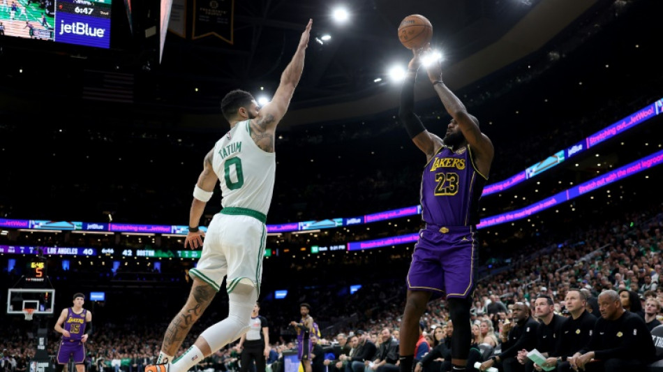 Tatum dominates as Celtics hold off Lakers; James injury scare