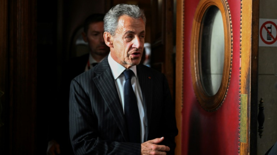 French court upholds Sarkozy conviction, softens sentence