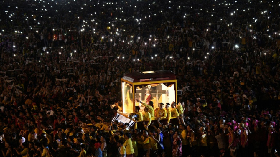 Crowds throng as Jesus statue parades through Philippine capital