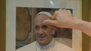 Pope's condition 'slightly improving' on seventh day in hospital