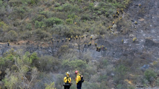 Massive California fire eases with rains