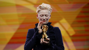 Swinton lashes out as she receives Berlin festival award