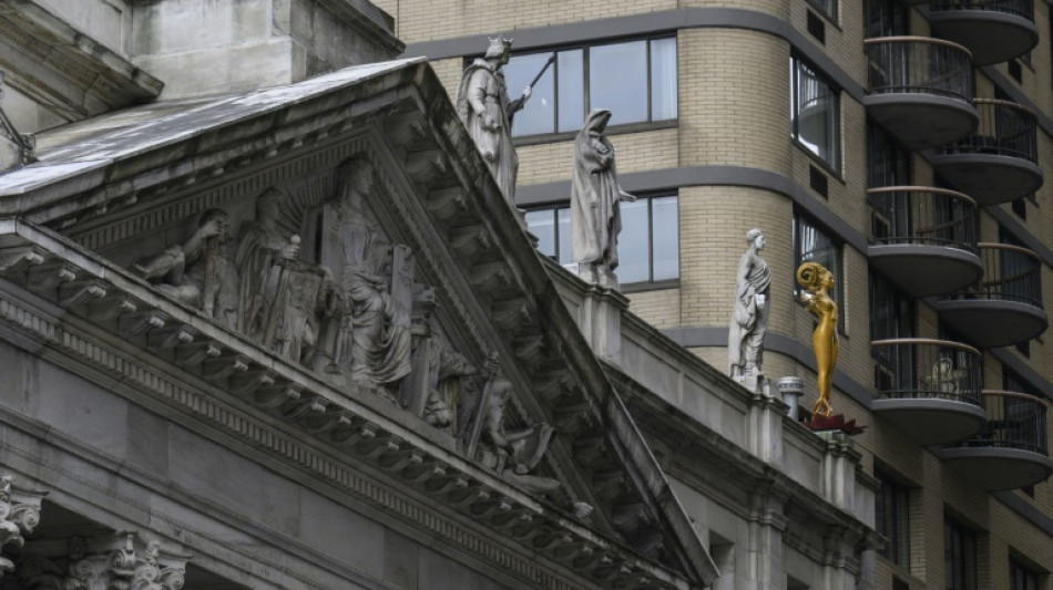 Woman statue finally takes spot beside Moses, Confucius at New York court