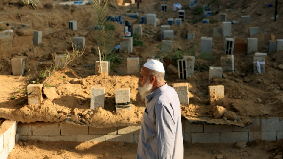 Gaza's overwhelmed undertakers stack 'graves on top of graves'